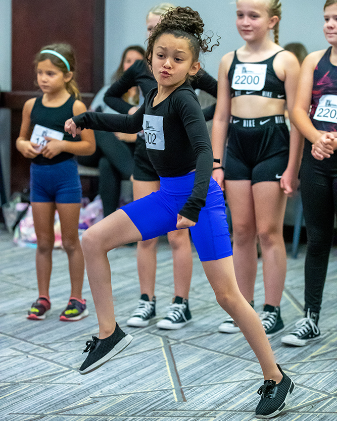 girl-dancing-to-side-leg-lifted
