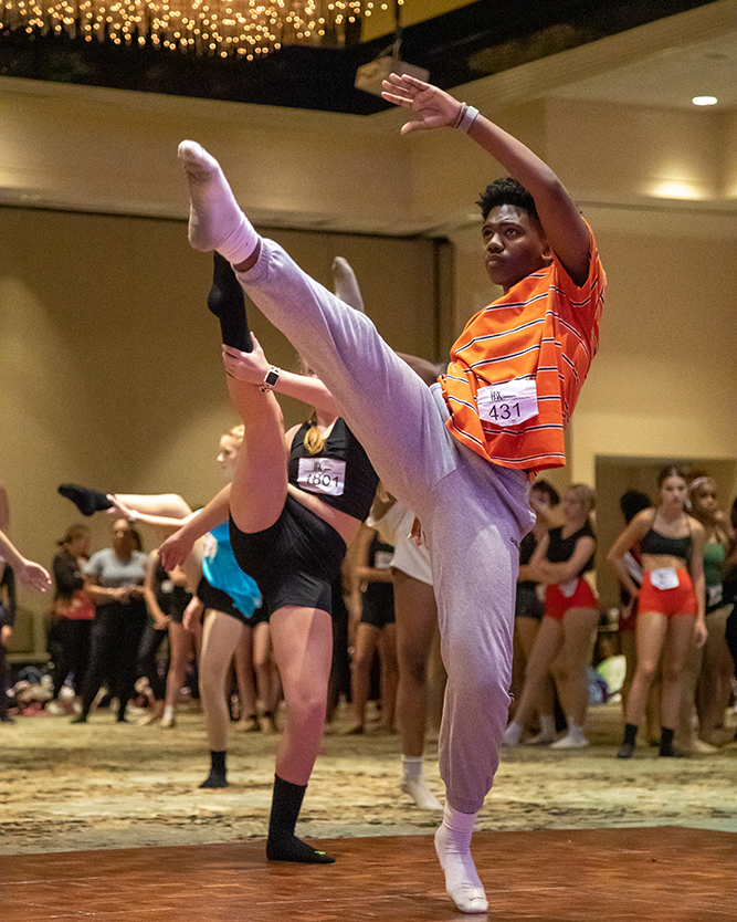 orange-shirt-dancer-high-leg